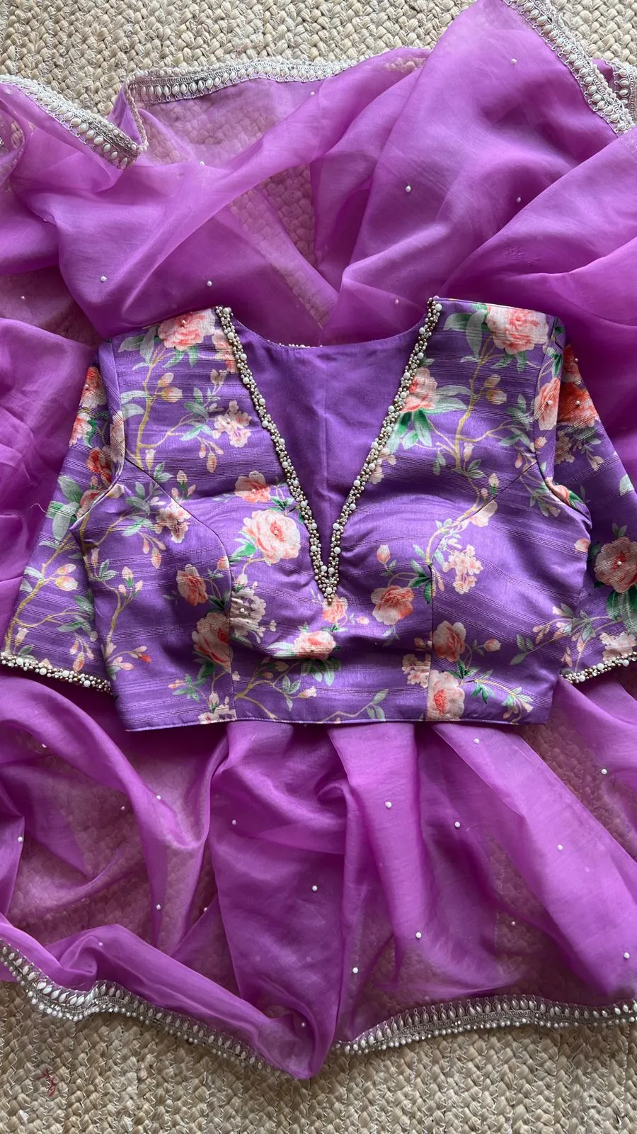 Lavender organza saree with pearl hand work blouse