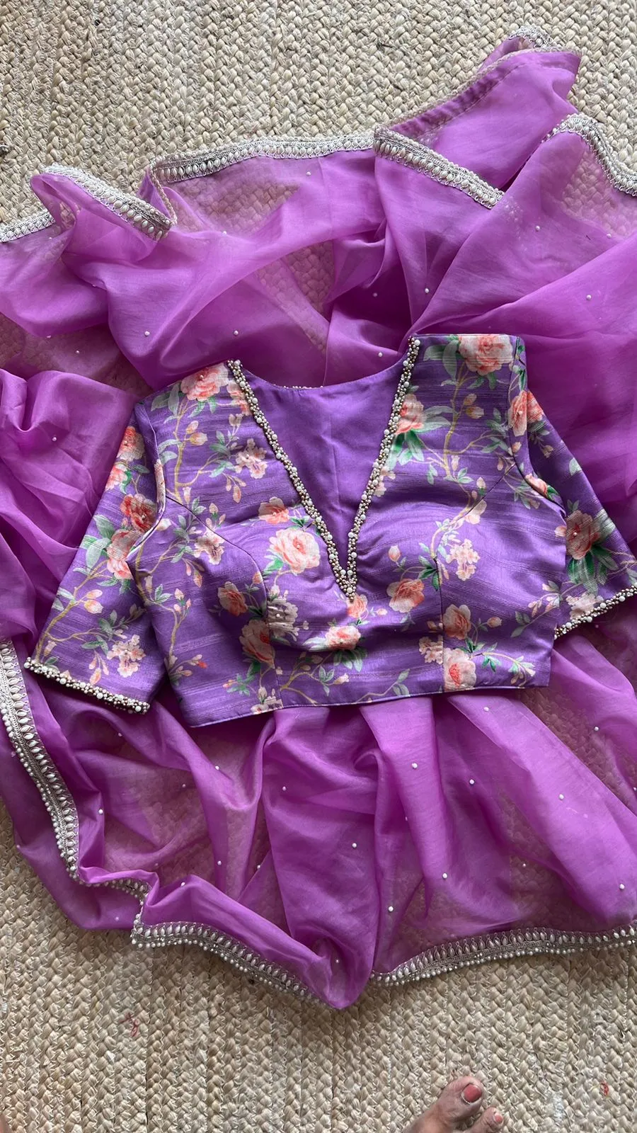 Lavender organza saree with pearl hand work blouse