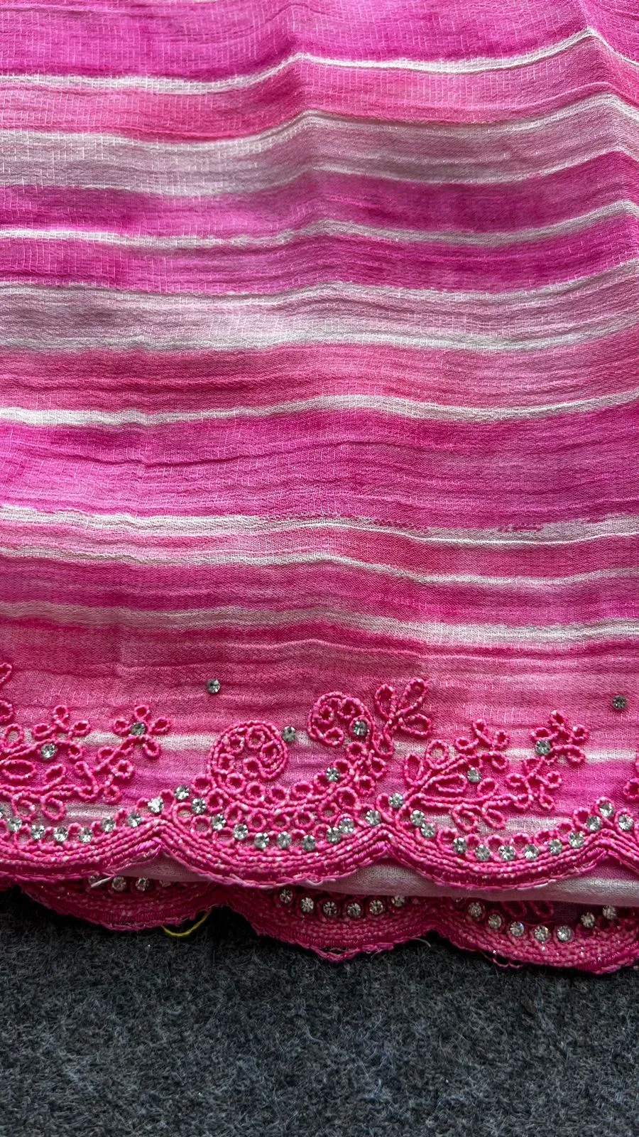 Pink chiffon stripped saree with cream hand work blouse